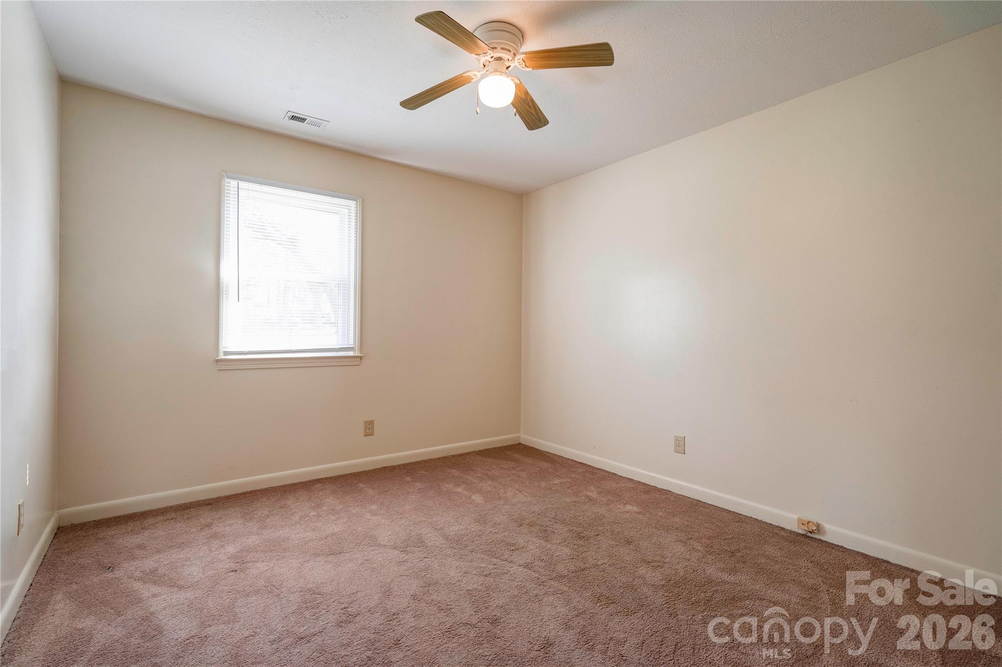 1904 Sulphur Springs Road Shelby, NC 28152 - Photo 22 of 27 an empty room with a window and a fan