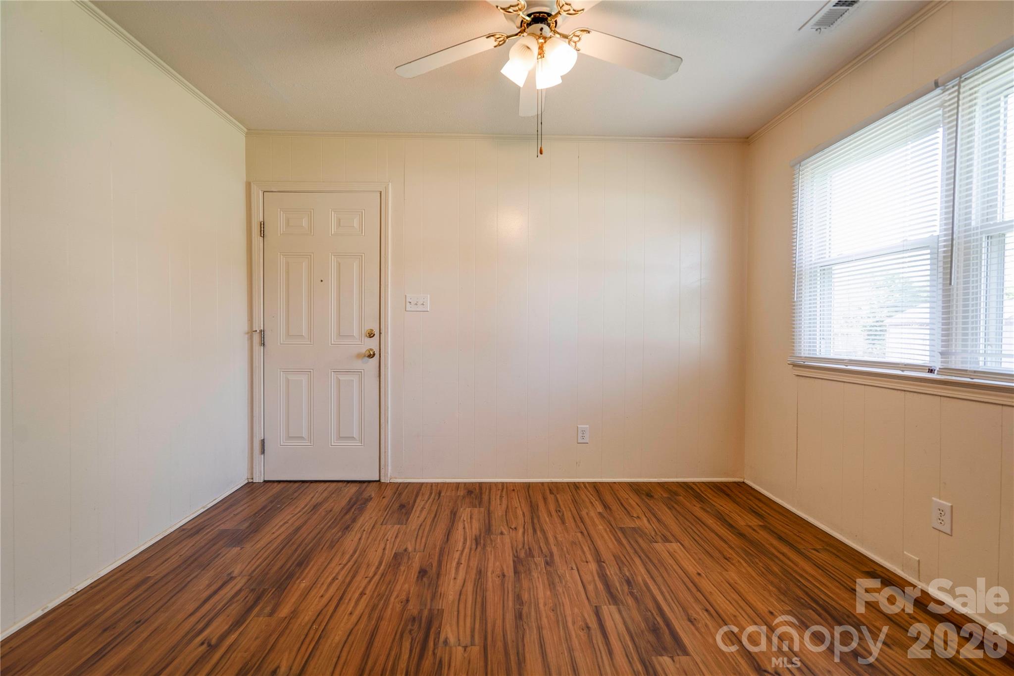 1904 Sulphur Springs Road Shelby, NC 28152 - Photo 5 of 27 an empty room with wooden floor and windows