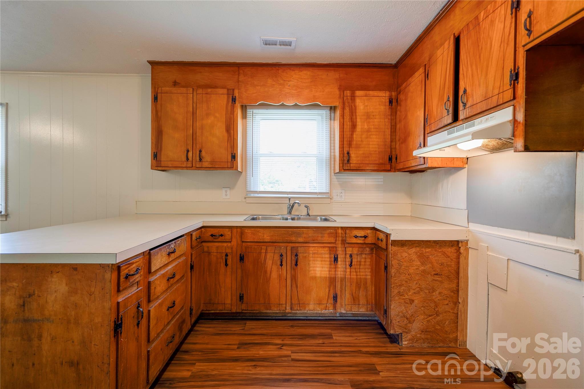 1904 Sulphur Springs Road Shelby, NC 28152 - Photo 9 of 27 a utility room with stainless steel appliances wooden cabinets and a sink