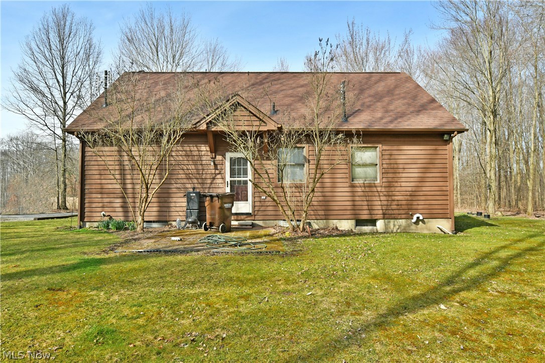 6570 Spencer Clark Road Fowler, OH 44418 - Photo 47 of 49 Back of house with a lawn