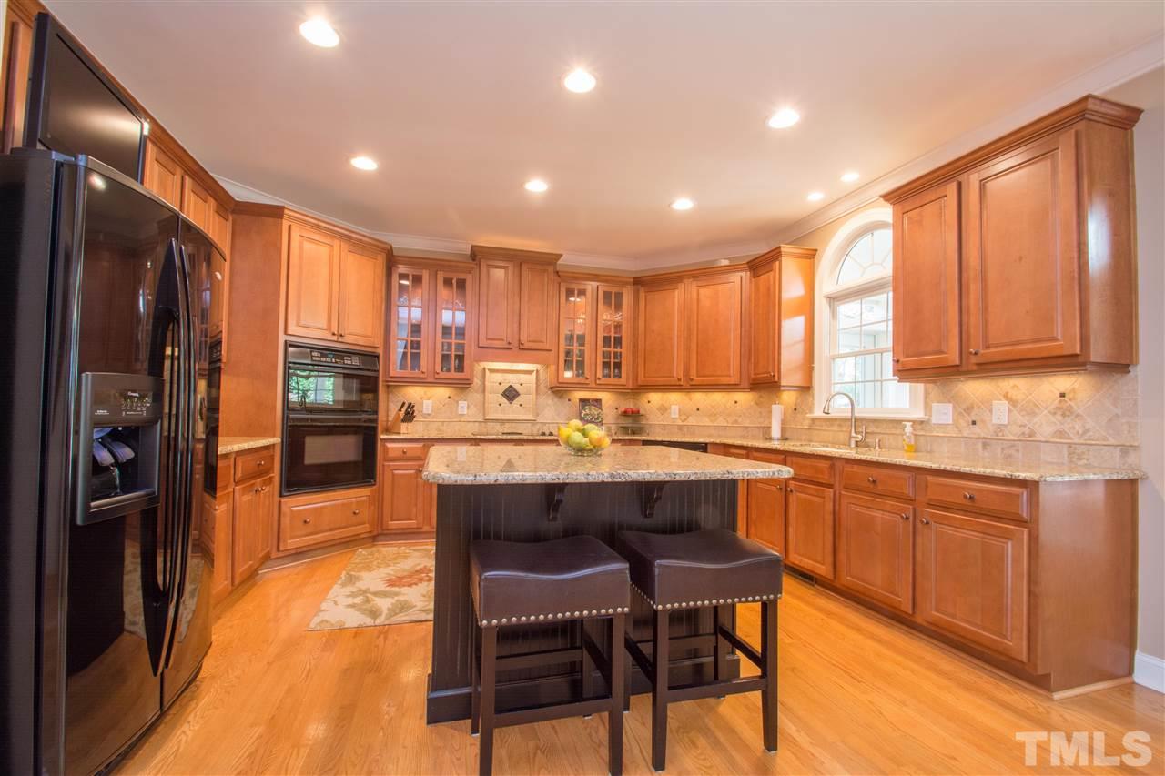 Granite counters, tile back splash, upgraded painted center island
