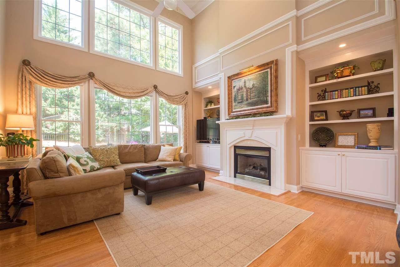 Gorgeous hardwood floors, gas log fireplace, wall of windows