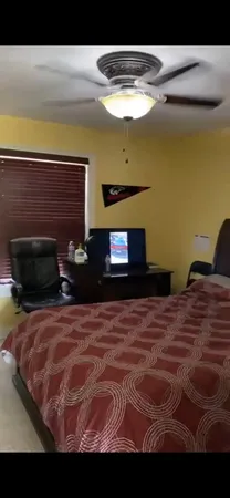 a bedroom with a bed and a fireplace