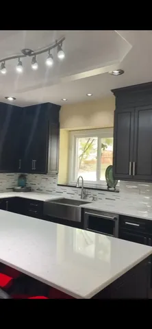 a view of kitchen sink and wooden floor