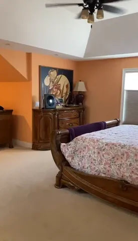 a bedroom with a bed and cabinets