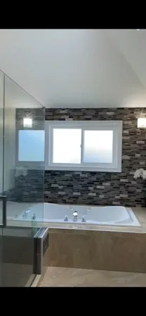 a view of room with wooden floor