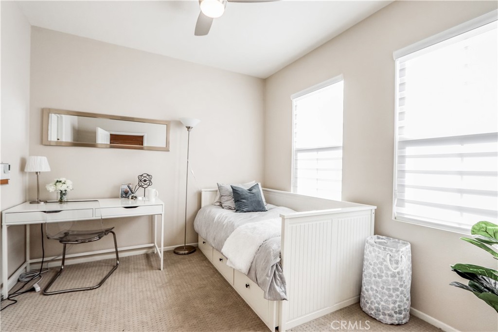 264 Lockford Irvine, CA 92602 - Photo 13 of 15 a bedroom with a bed and a table
