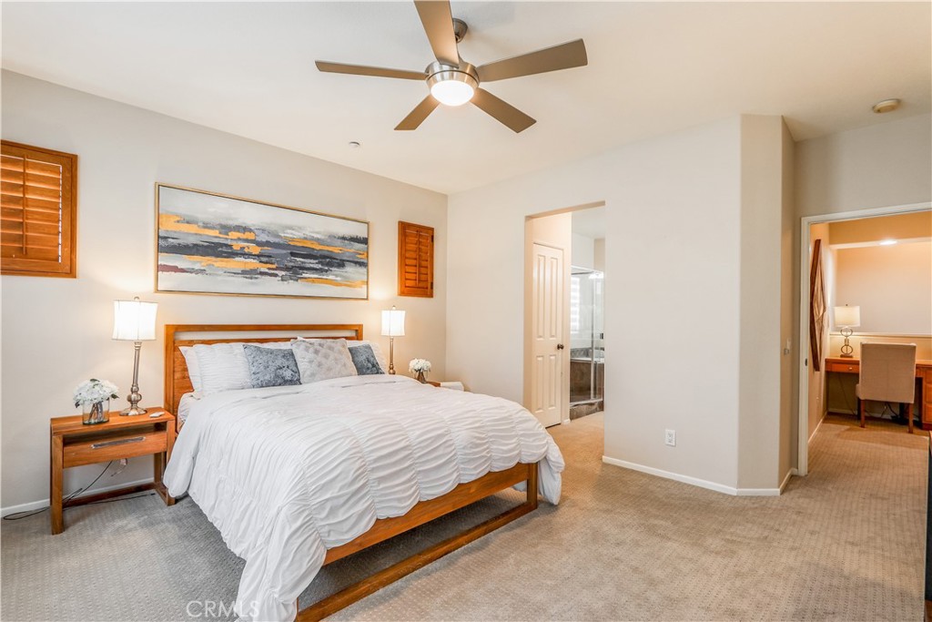 264 Lockford Irvine, CA 92602 - Photo 8 of 15 a bedroom with a bed and a chandelier