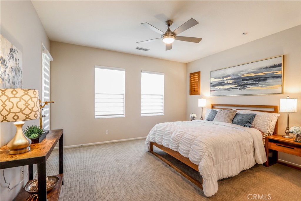 264 Lockford Irvine, CA 92602 - Photo 9 of 15 a bedroom with a bed and a chandelier