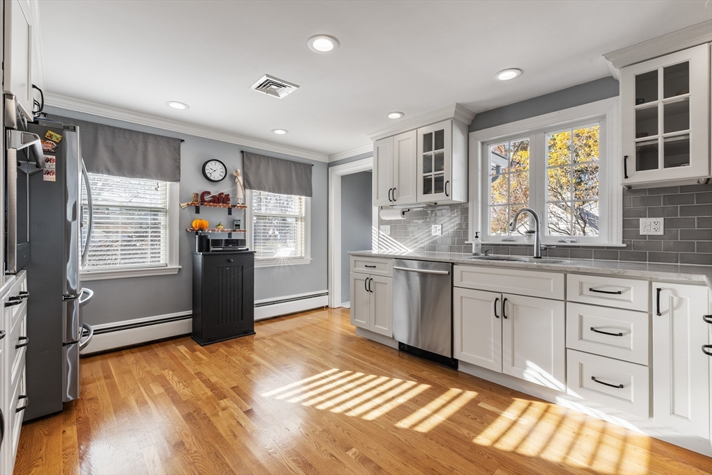 3 Suntaug Street Lynnfield, MA 01940 - Photo 23 of 42 a kitchen with granite countertop a refrigerator and cabinets