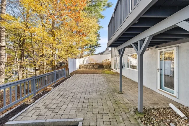 a view of a porch with wooden fence and floor