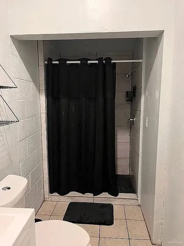 a bathroom with a sink and shower