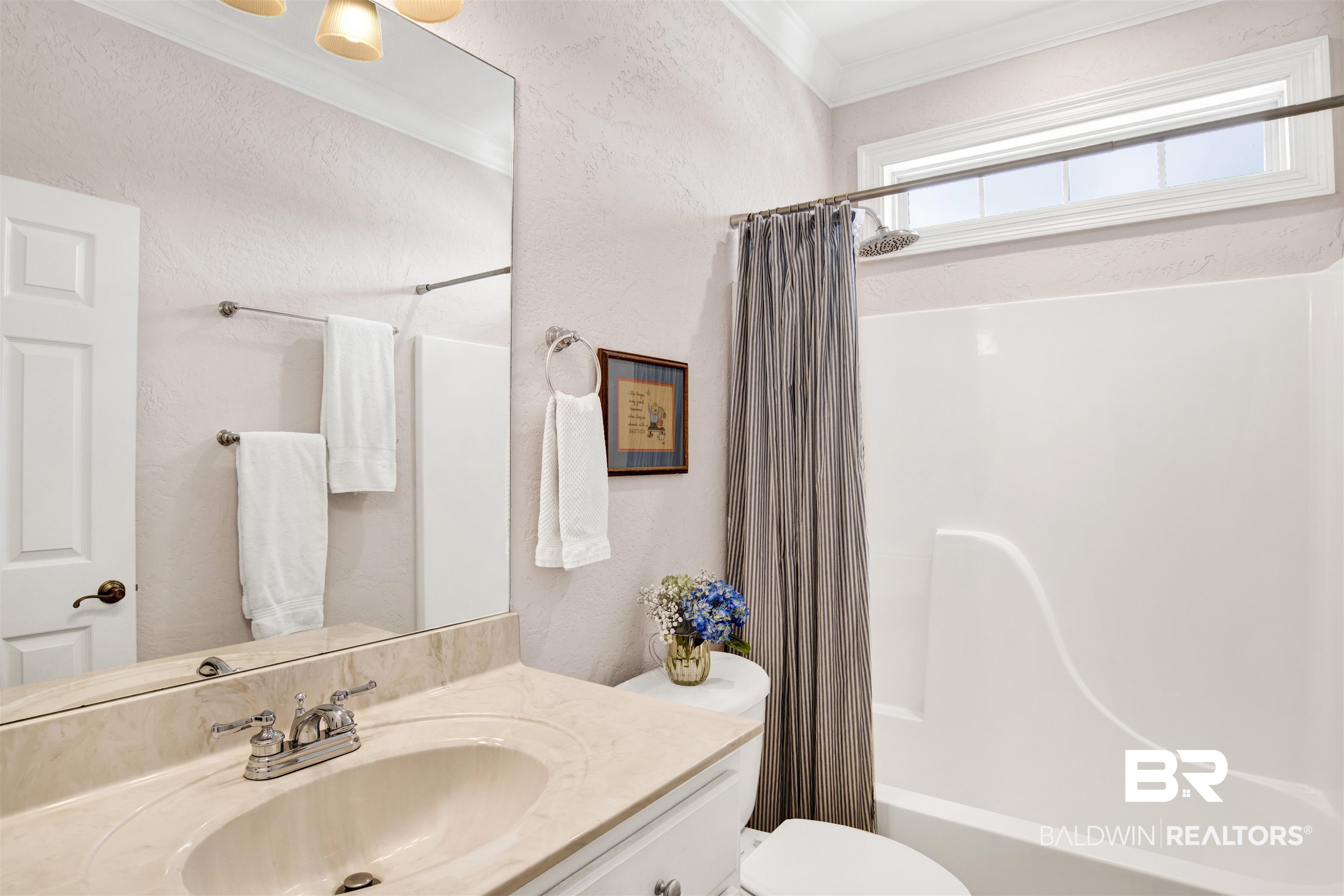31295 River Road Orange Beach, AL 36561 - Photo 18 of 58 Full bathroom with crown molding, vanity, shower / tub combo, and toilet