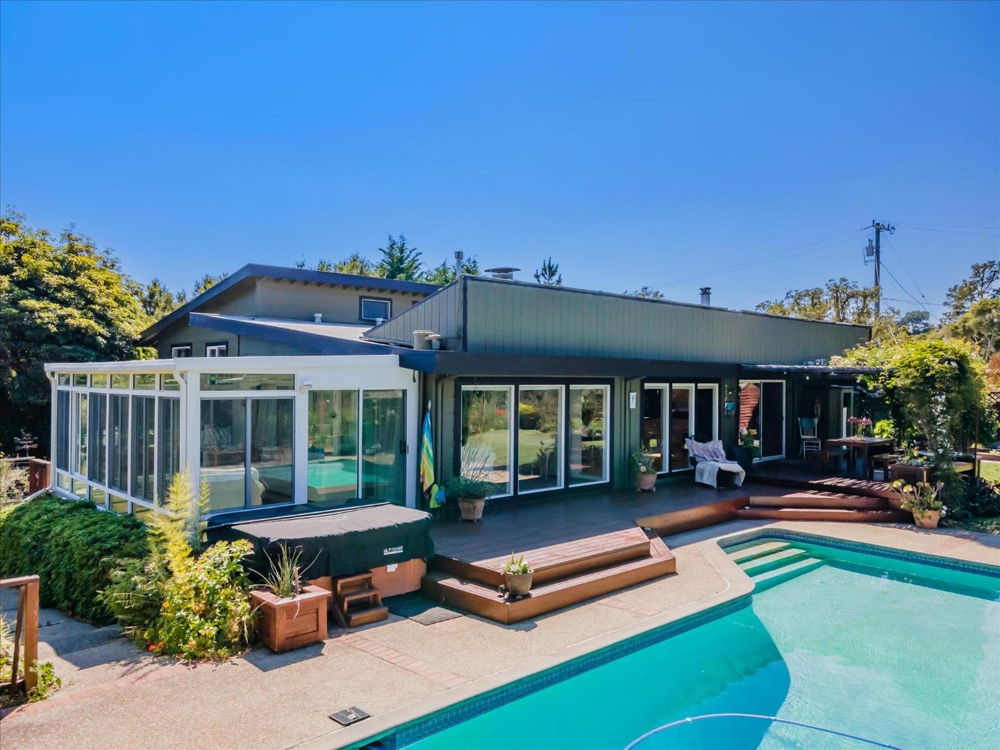 a backyard of a house with outdoor seating