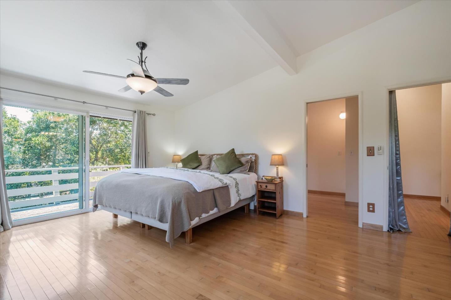 3386 Haas Drive Aptos, CA 95003 - Photo 21 of 56 a spacious bedroom with a bed and dresser with wooden floor