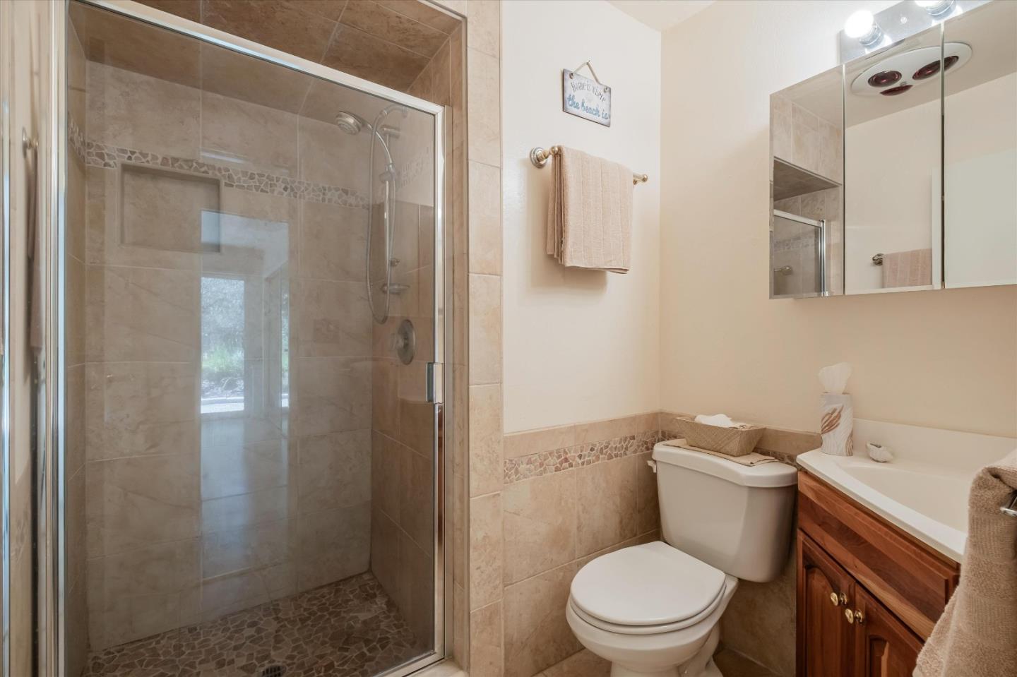 3386 Haas Drive Aptos, CA 95003 - Photo 30 of 56 a white toilet sitting next to a bathroom sink