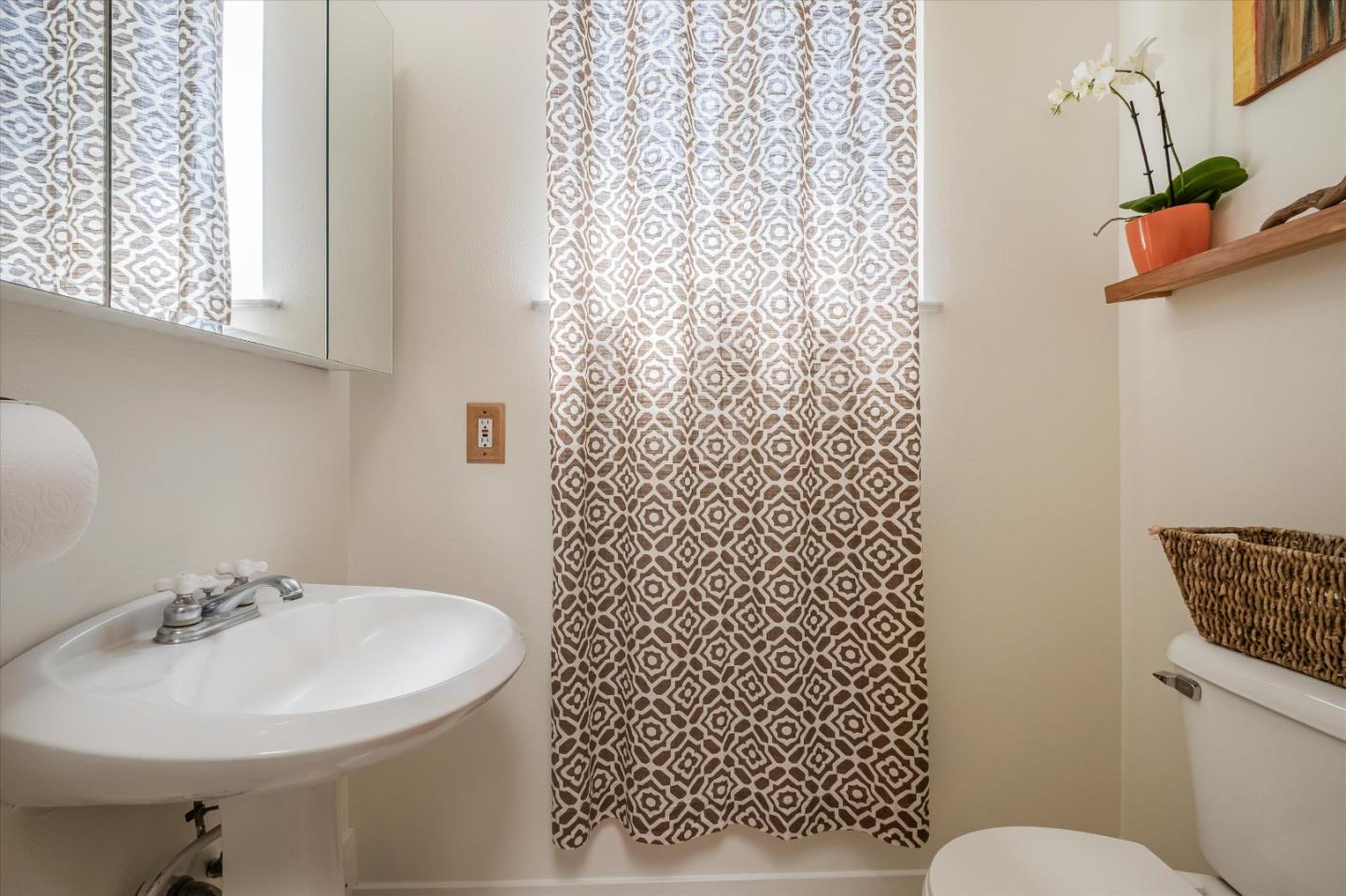 3386 Haas Drive Aptos, CA 95003 - Photo 36 of 56 a bathroom with a sink a toilet and shower curtain