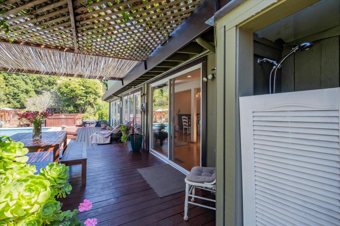 3386 Haas Drive Aptos, CA 95003 - Photo 38 of 56 a view of a porch with chairs and potted plants