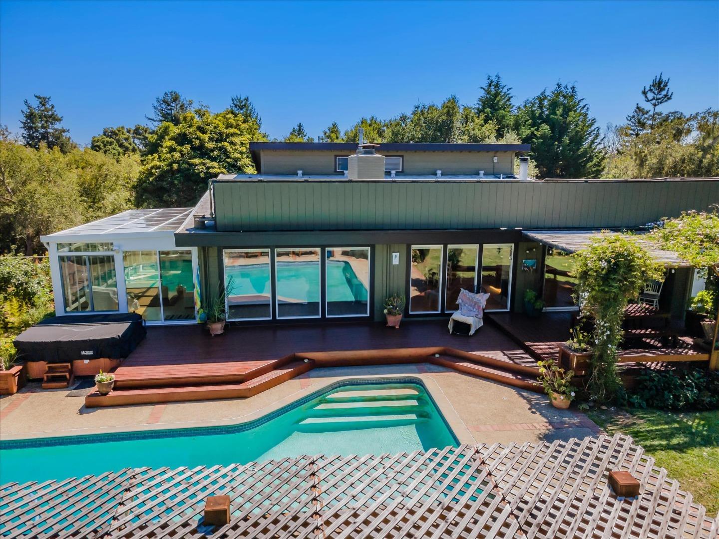 3386 Haas Drive Aptos, CA 95003 - Photo 45 of 56 a view of a patio with table and chairs potted plants and large tree