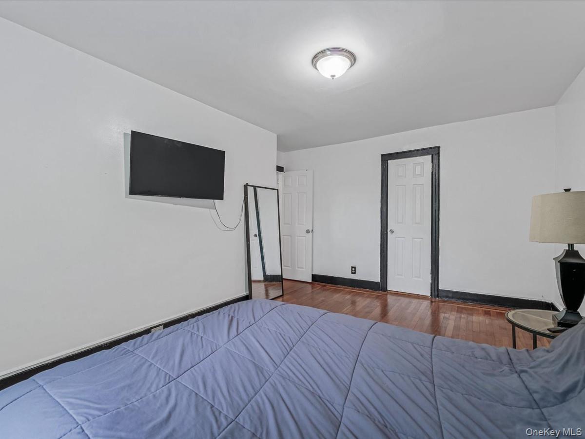 172-09 Sayres Avenue Queens, NY 11433 - Photo 15 of 23 a view of empty room with wooden floor