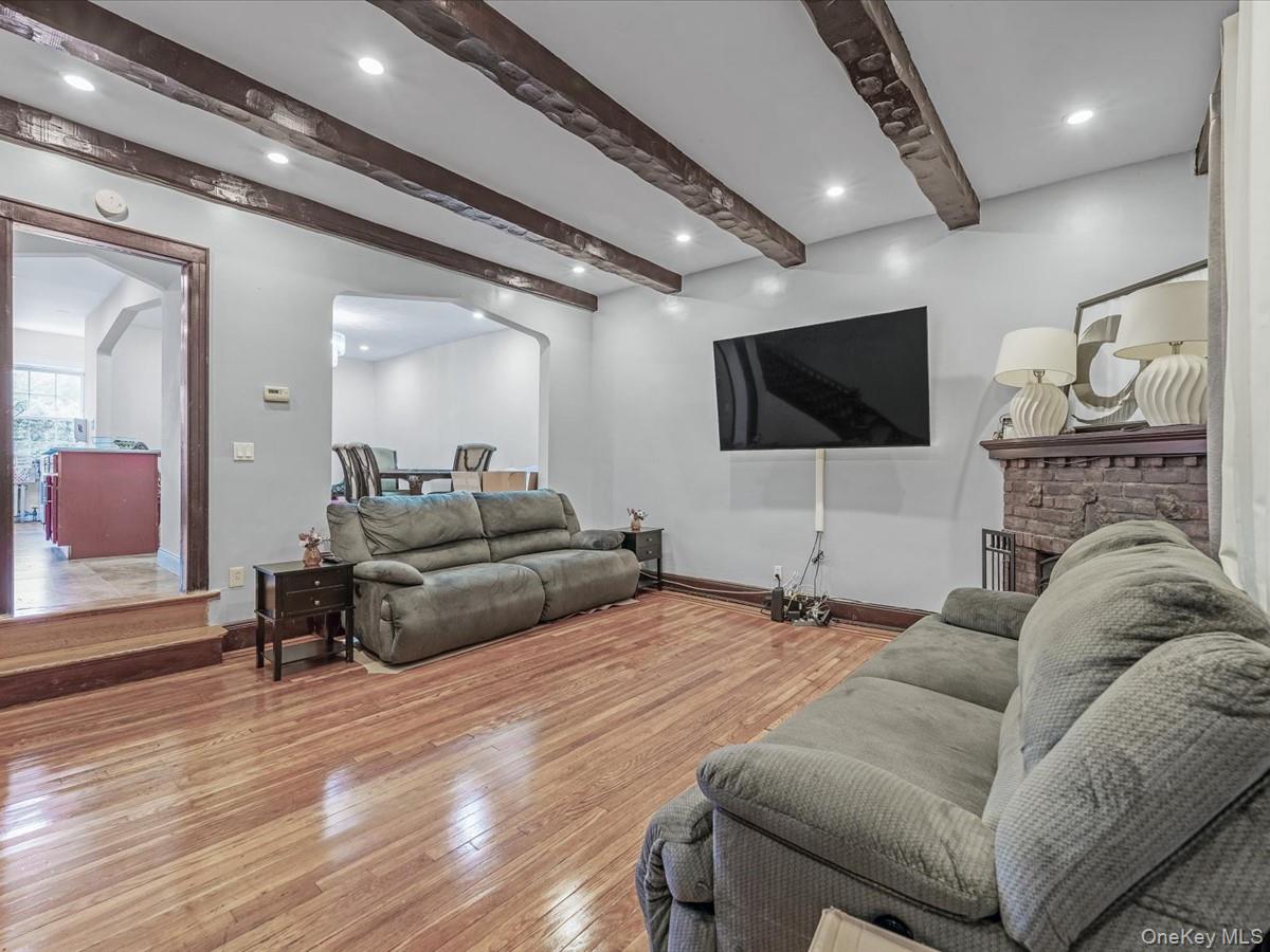 172-09 Sayres Avenue Queens, NY 11433 - Photo 3 of 23 a living room with furniture and a flat screen tv