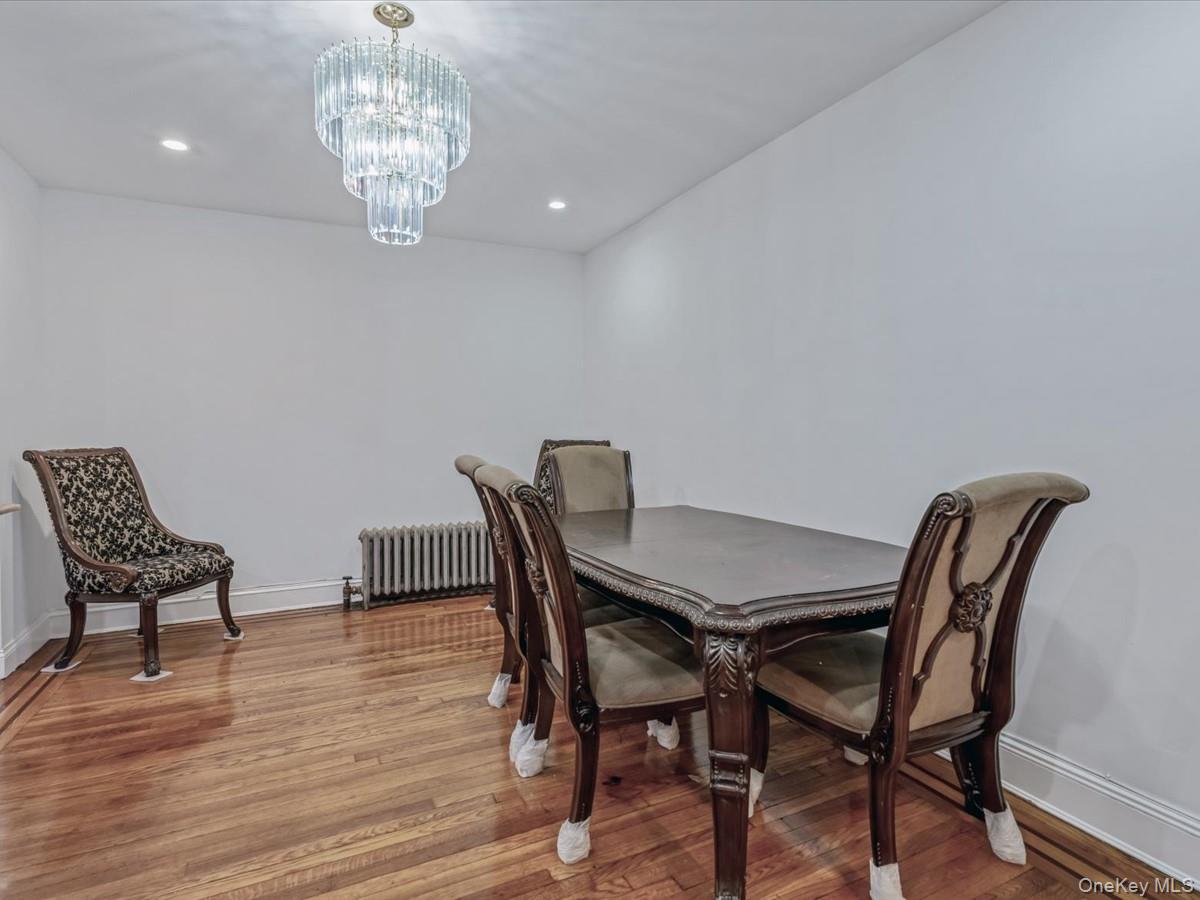 172-09 Sayres Avenue Queens, NY 11433 - Photo 5 of 23 a view of a dining room with furniture and chandelier