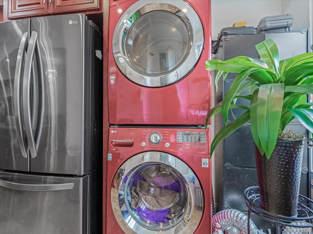 172-09 Sayres Avenue Queens, NY 11433 - Photo 9 of 23 a utility room with dryer and washer