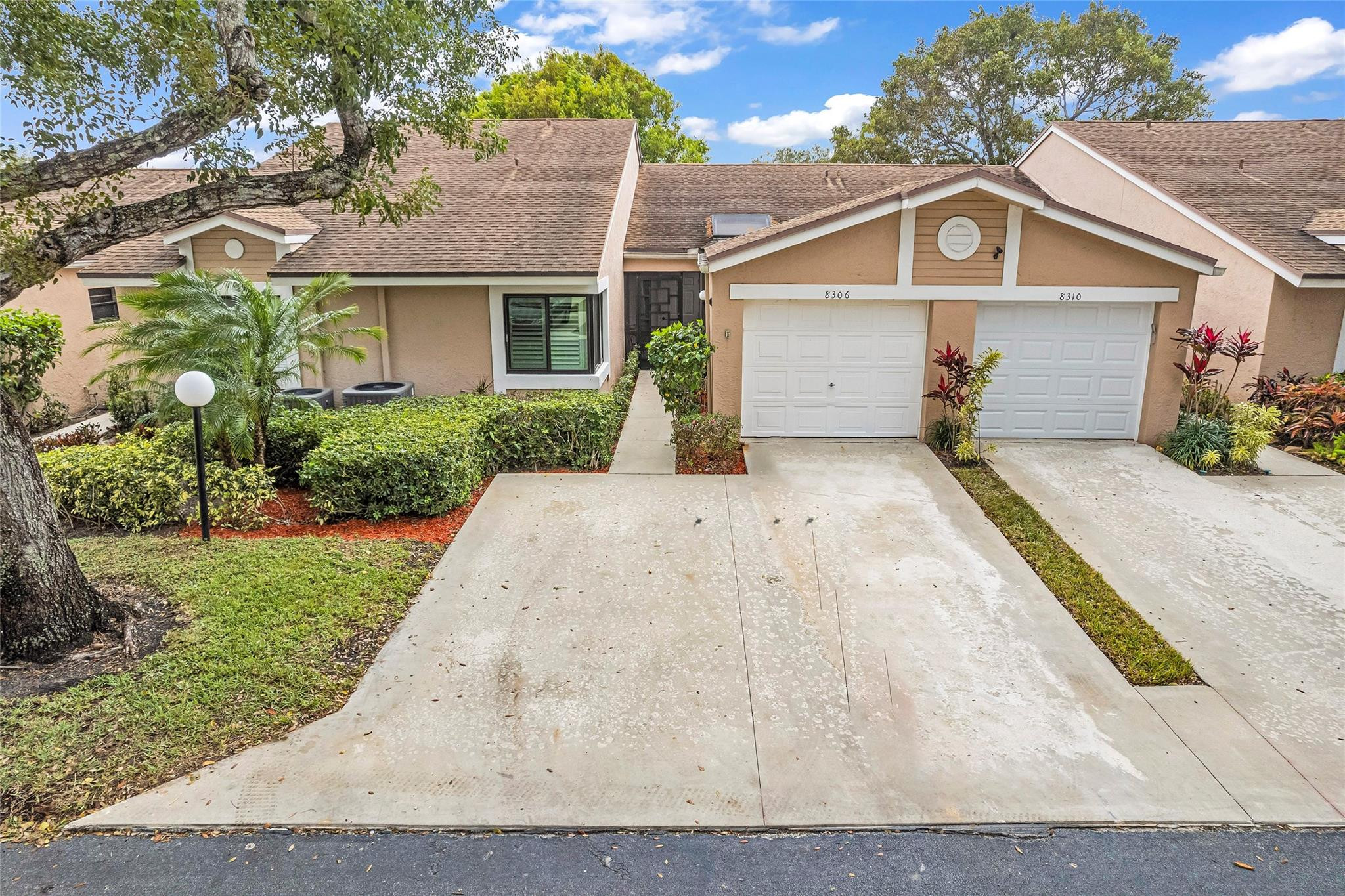 8306 Springlake Drive, Unit C Boca Raton, FL 33496 - Photo 1 of 44 front view of a house with a yard