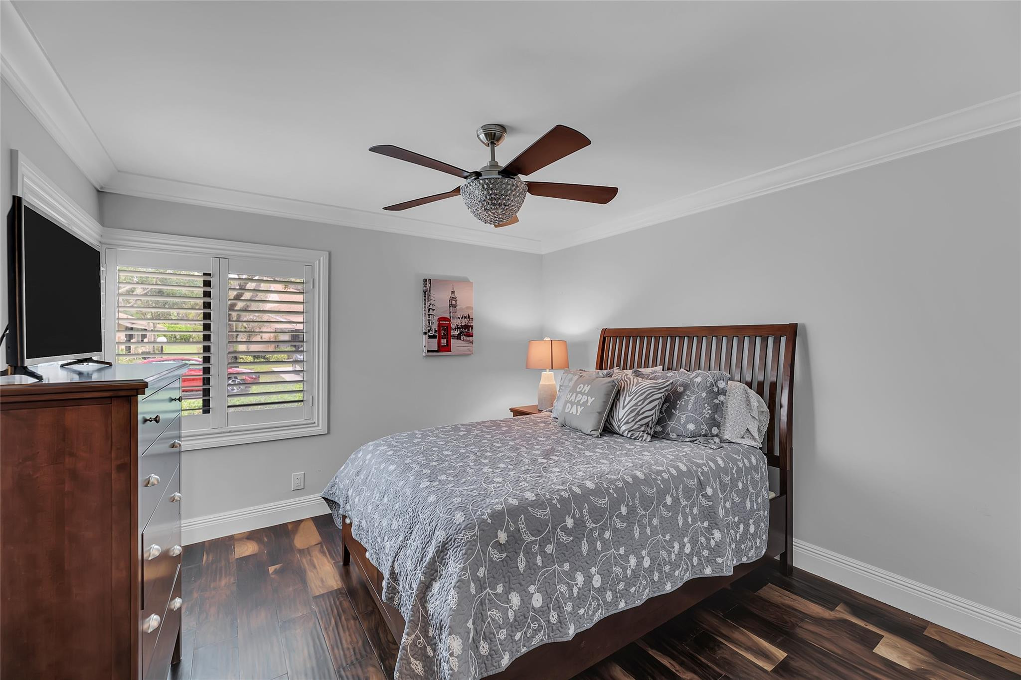 8306 Springlake Drive, Unit C Boca Raton, FL 33496 - Photo 36 of 44 a bedroom with a bed and a flat screen tv