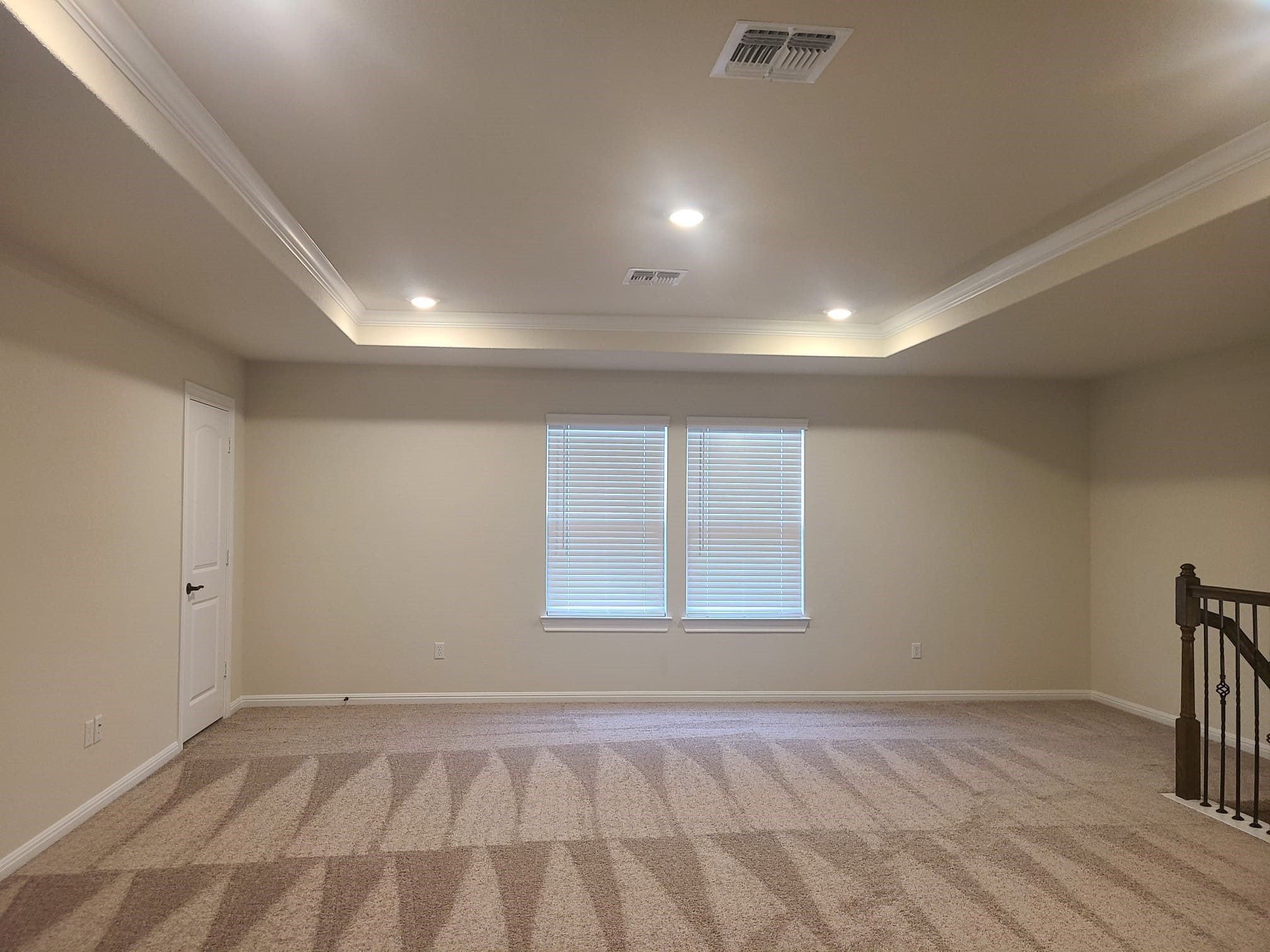 32 Pacific Loon Street Leander, TX 78641 - Photo 16 of 34 an empty room with wooden floor and windows