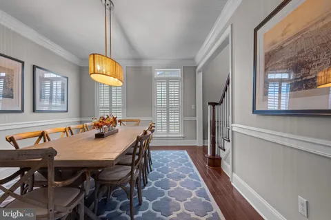 a view of a dining room with furniture and window