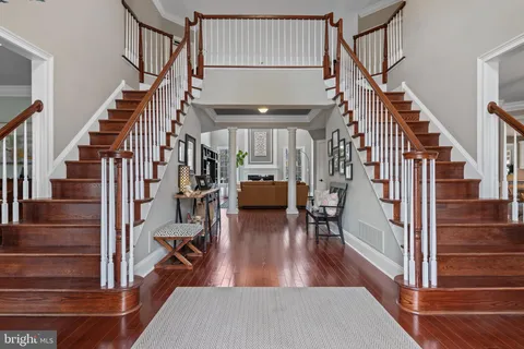 a view of entryway livingroom and hall with wooden floor