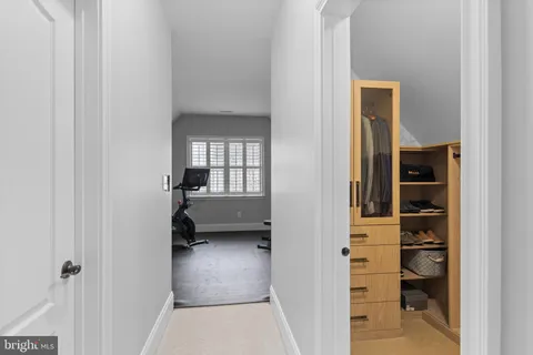 a view of a workspace with gym cycle and a window