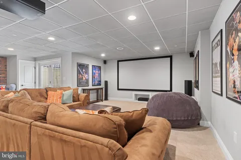 a living room with furniture a projector and a table