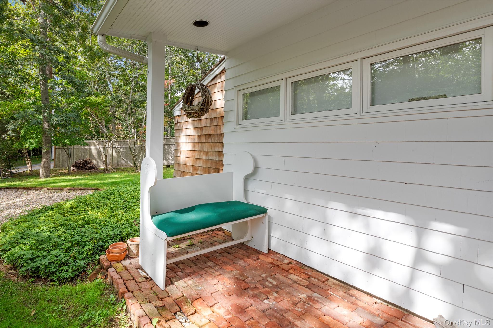 a view of a two chairs in the yard