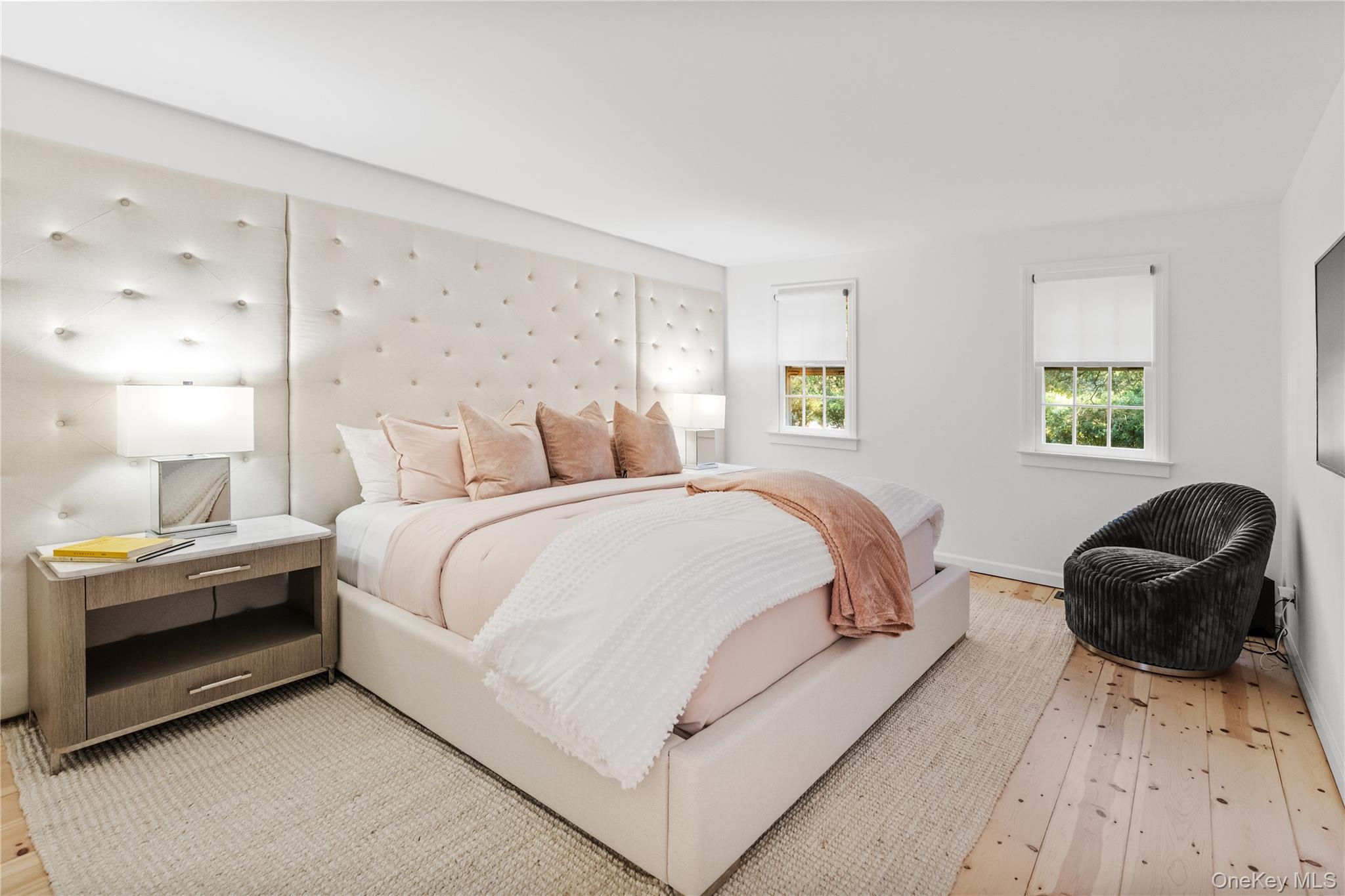 197 Hog Creek Road East Hampton, NY 11937 - Photo 15 of 17 a bedroom with a bed and a chair