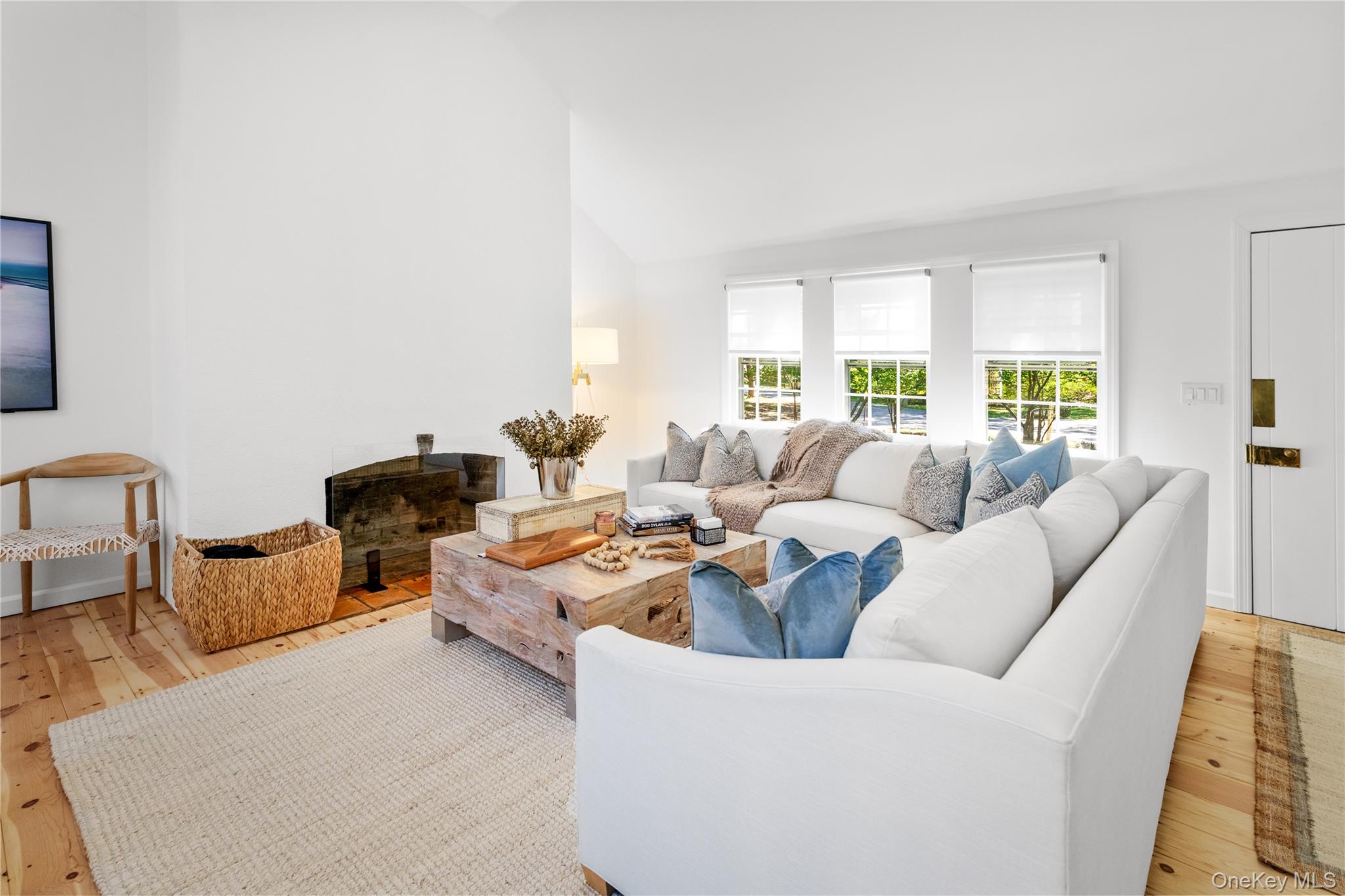 197 Hog Creek Road East Hampton, NY 11937 - Photo 3 of 17 a living room with furniture and a large window