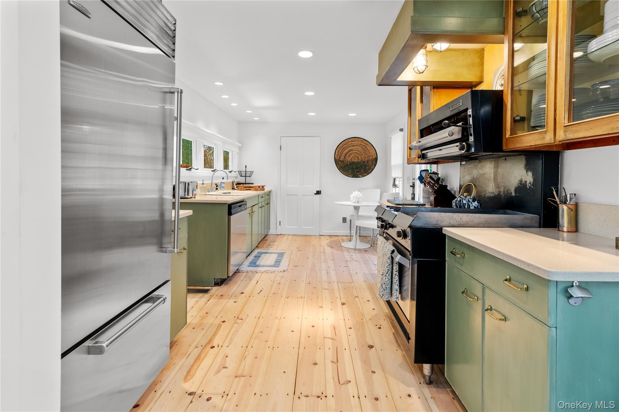 197 Hog Creek Road East Hampton, NY 11937 - Photo 7 of 17 a kitchen with a sink appliances and cabinets