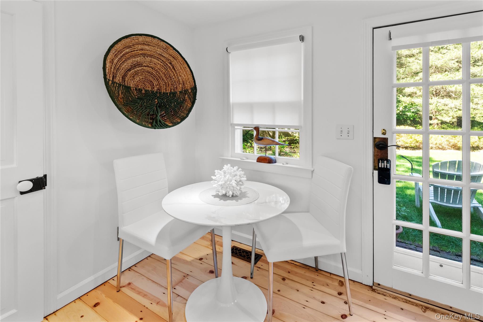 197 Hog Creek Road East Hampton, NY 11937 - Photo 8 of 17 a dining room with furniture and a window