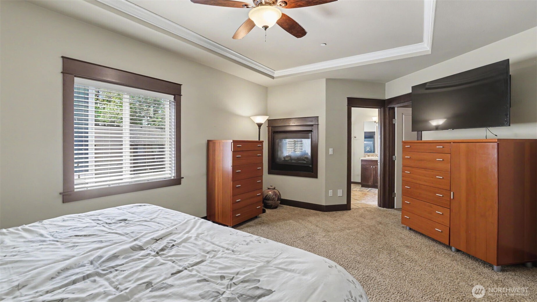1357 Elma Place Northeast Renton, WA 98059 - Photo 16 of 40 a bedroom with a bed and a flat screen tv