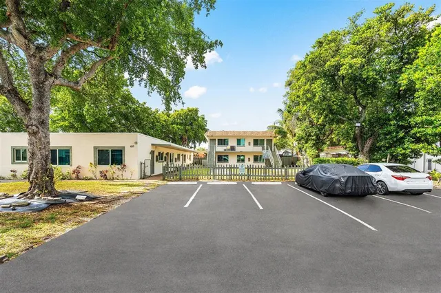 a view of street with parked cars