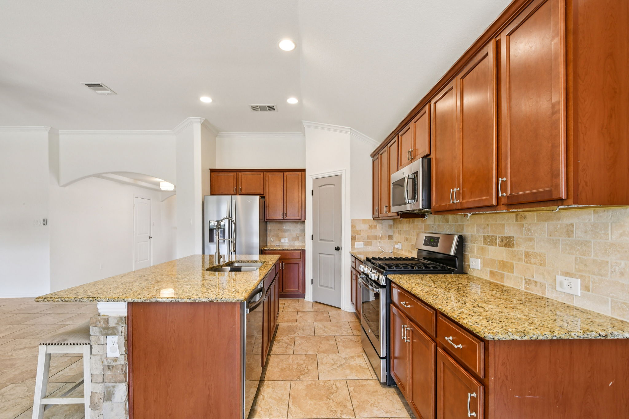 329 Evening Star Kyle, TX 78640 - Photo 12 of 30 Generous cabinetry, long counters, and a layout that makes prepping easy and hosting fun.