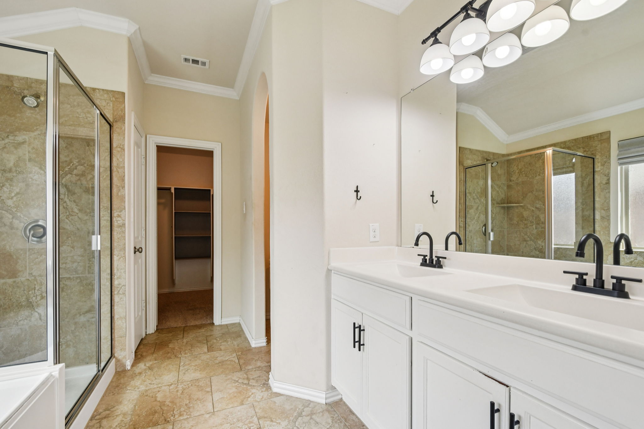 329 Evening Star Kyle, TX 78640 - Photo 19 of 30 Primary ensuite features a double vanity setup so mornings can run on schedule, not negotiations.