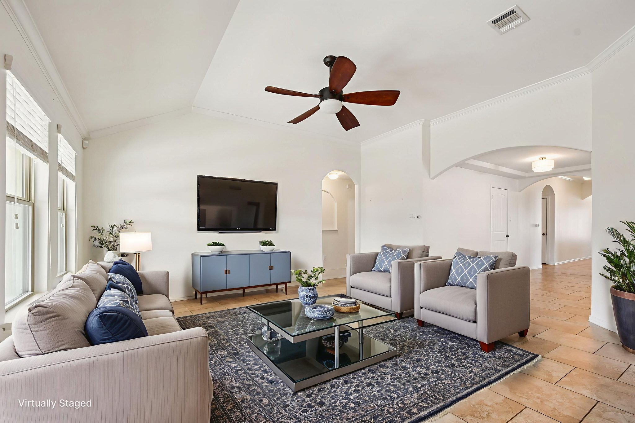 329 Evening Star Kyle, TX 78640 - Photo 2 of 30 The living room has vaulted ceilings, tons of light, and plenty of space to spread out.