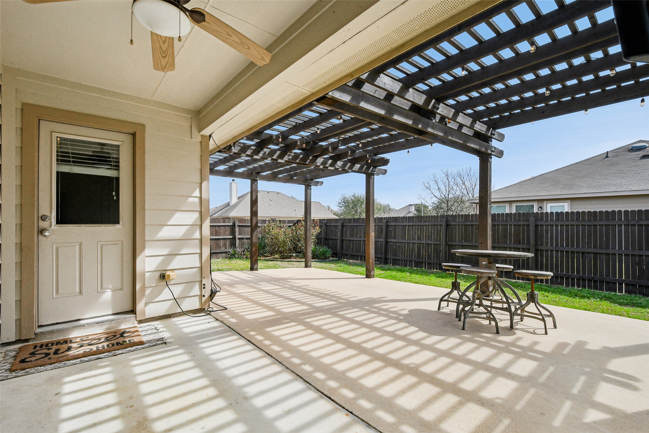 329 Evening Star Kyle, TX 78640 - Photo 22 of 30 Covered patio + pergola vibes = you go-to spot for grilling and lounging.