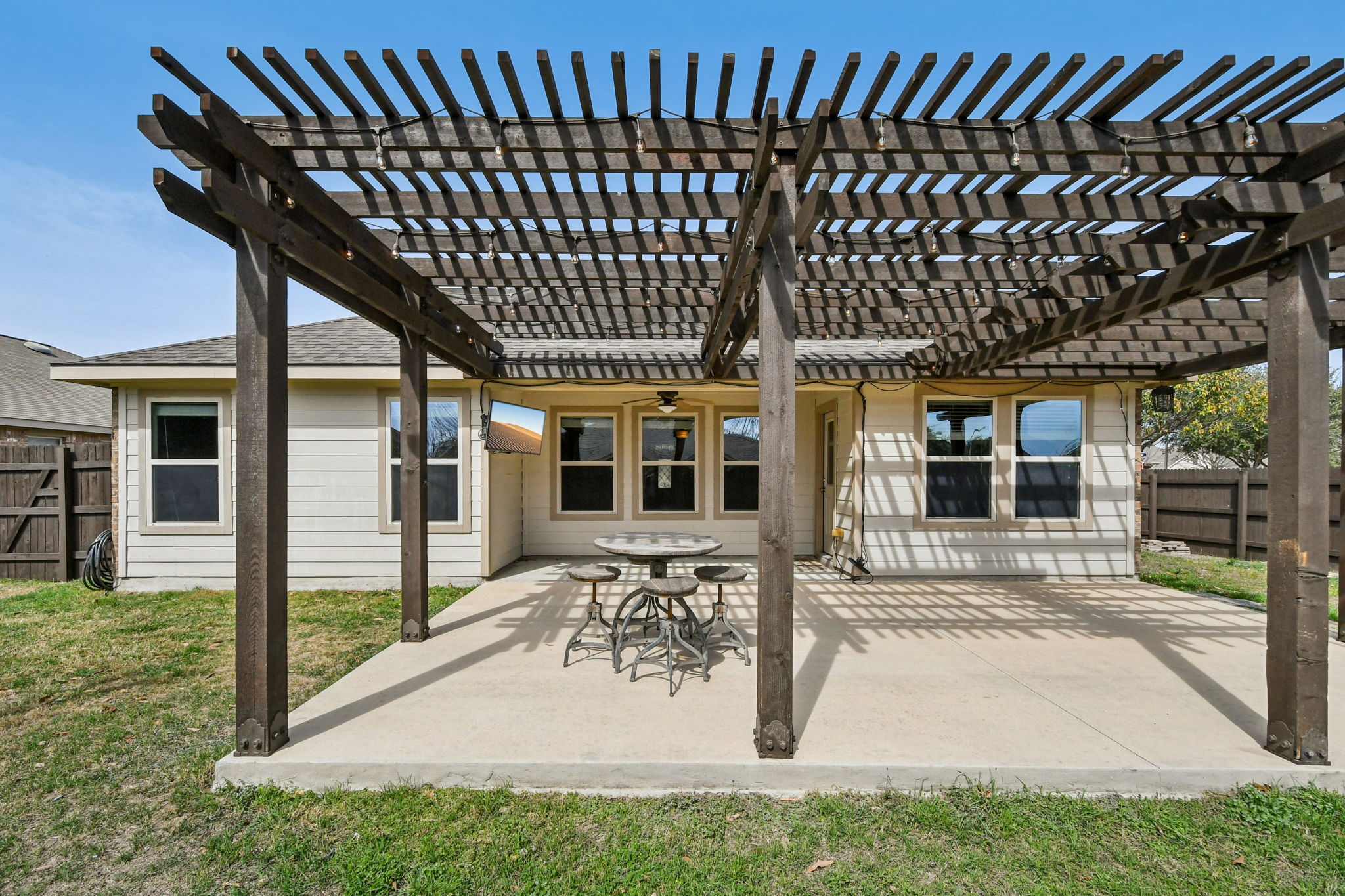329 Evening Star Kyle, TX 78640 - Photo 24 of 30 The pergola makes a statement and creates an easy “outdoor living room” moment with your favorie people.