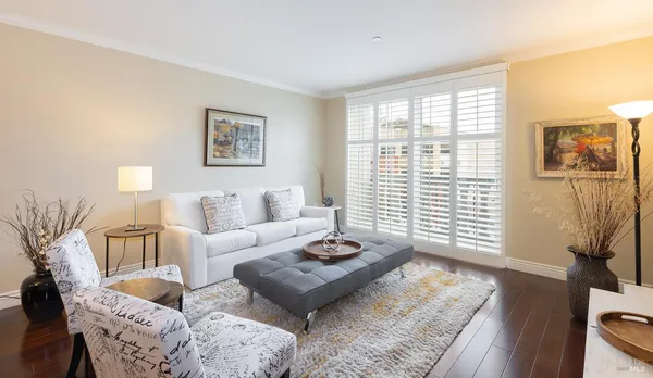 a living room with furniture and a window