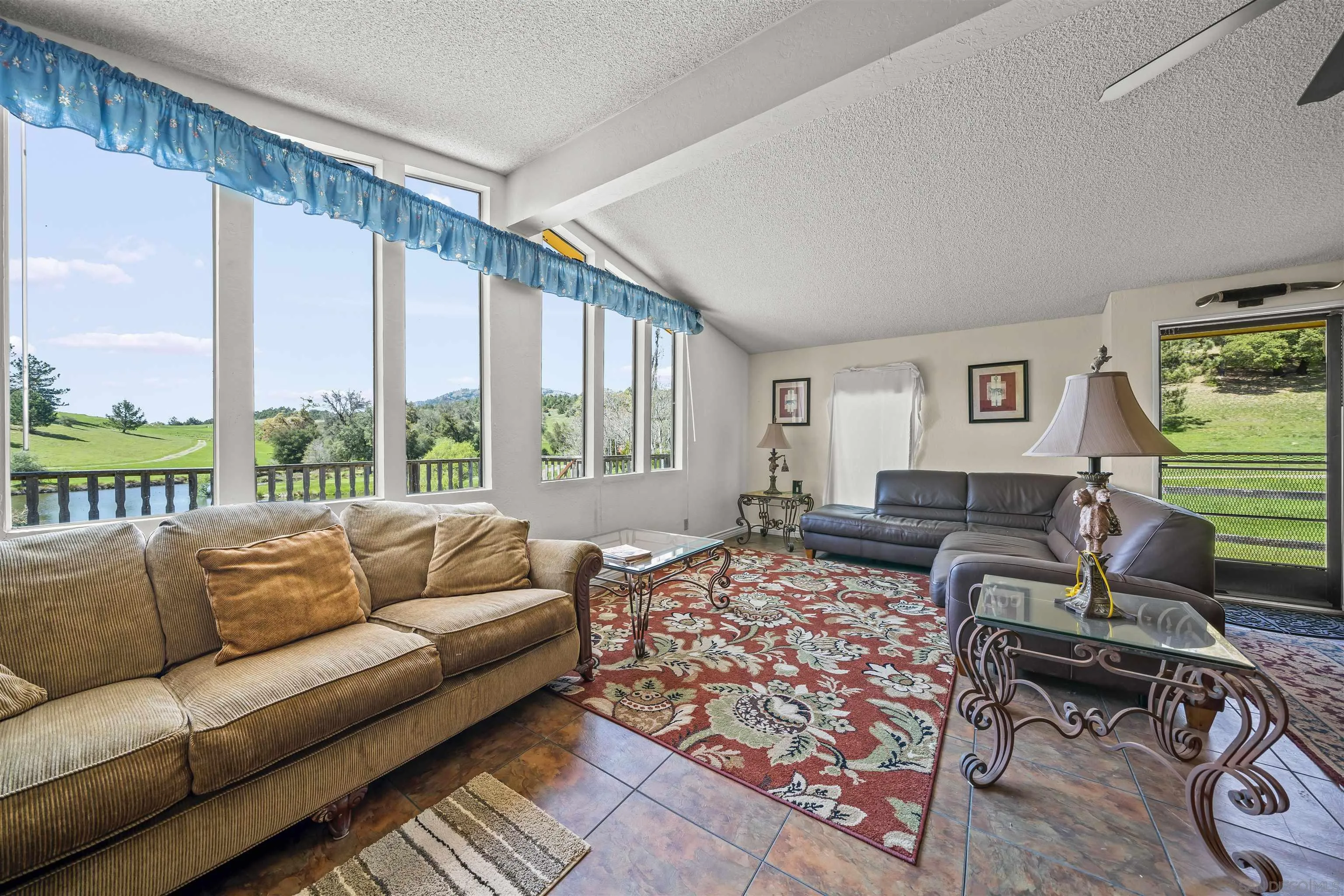 2464 Wynola Road Julian, CA 92036 - Photo 36 of 50 a living room with furniture and a large window