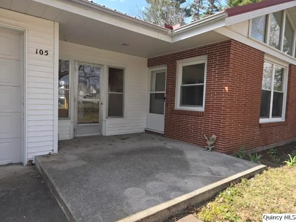 a front view of a house with yard