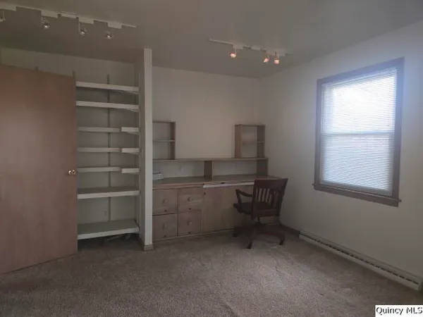 a kitchen with a cabinets and a stove top oven